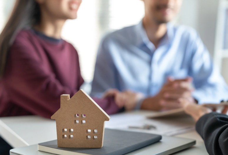 Homeowners sitting down for a cash home offer consultation — Houses 4 Texas San Antonio TX